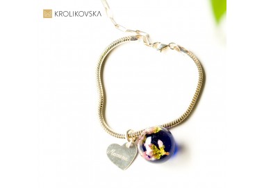 Bransoletka srebrna z motywem roślinnym.